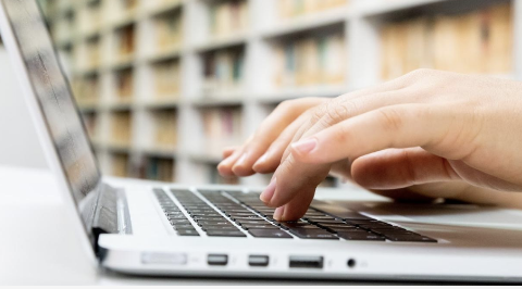 typing on the laptop