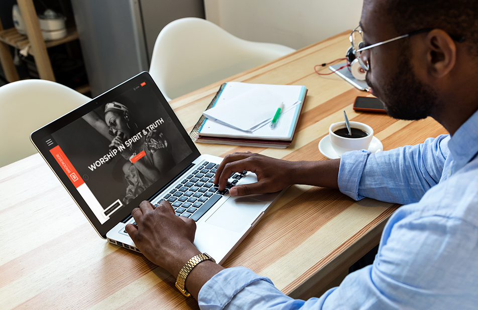 Person working on top of the table with laptop
