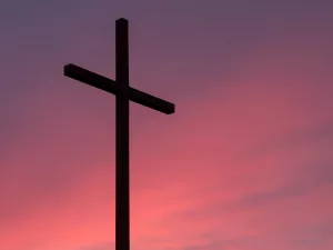 Cross during a pink sunset