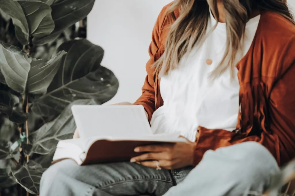 Woman sitting down reading the Bible
