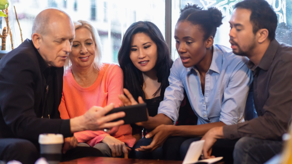 Smiling Friends Sharing Something on Phone Screen