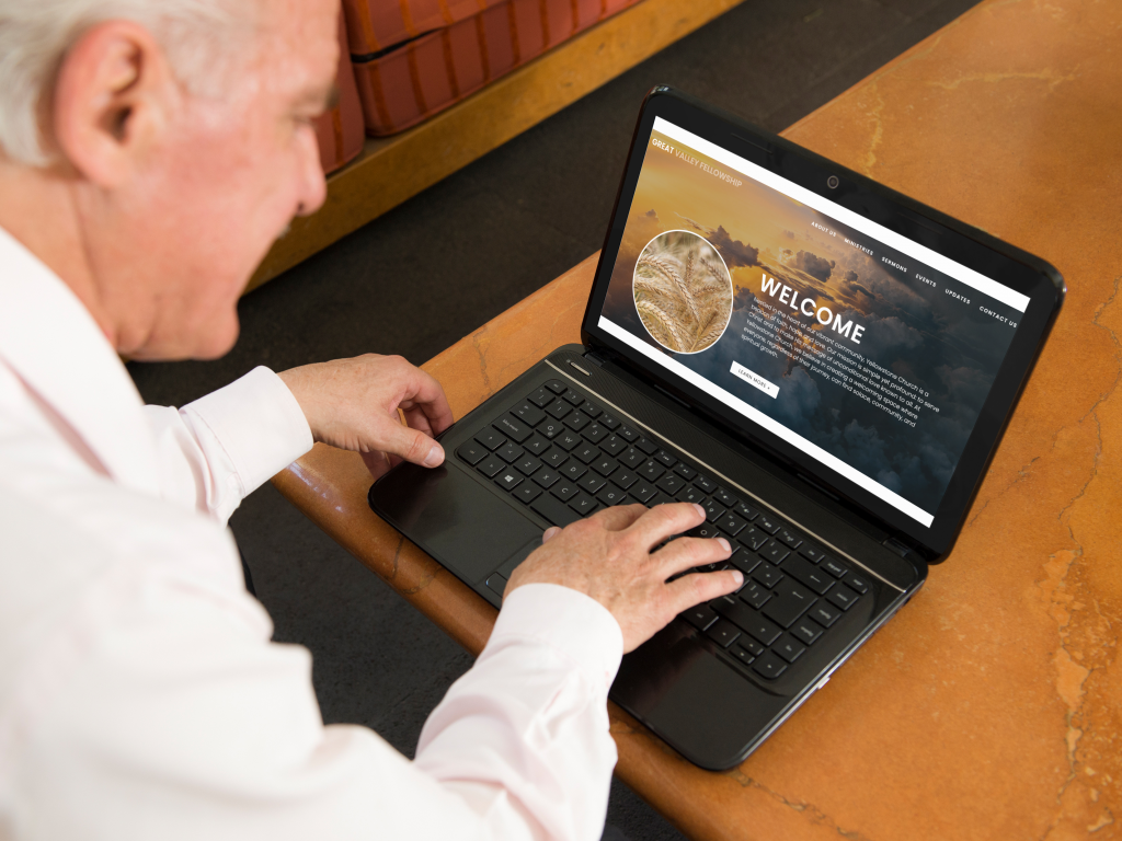 elderly man on laptop browsing