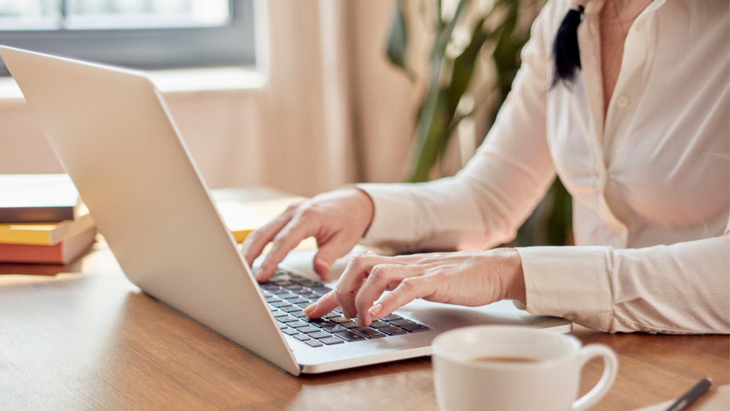 hands on top of the laptop