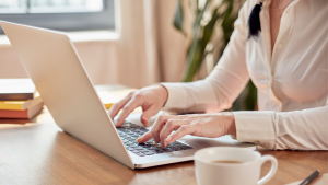 hands on top of the laptop