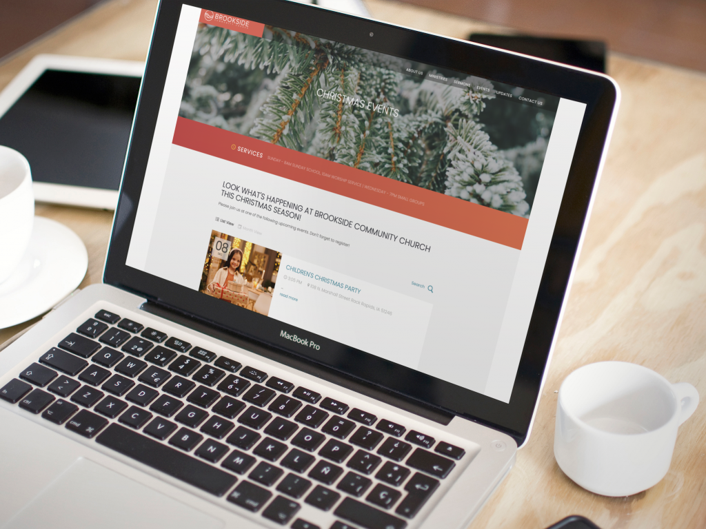 laptop on top of the table with a mug beside