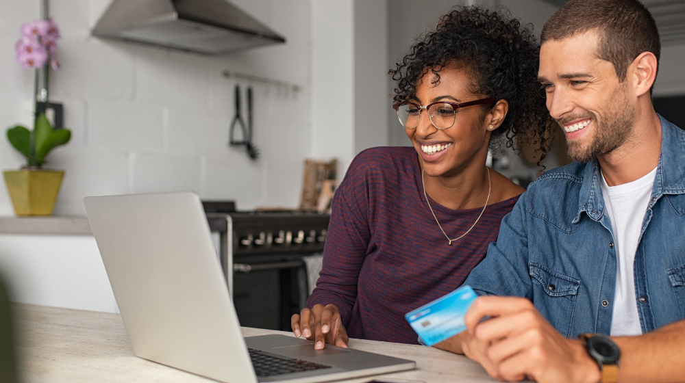 Happy Couple Making Online Payment