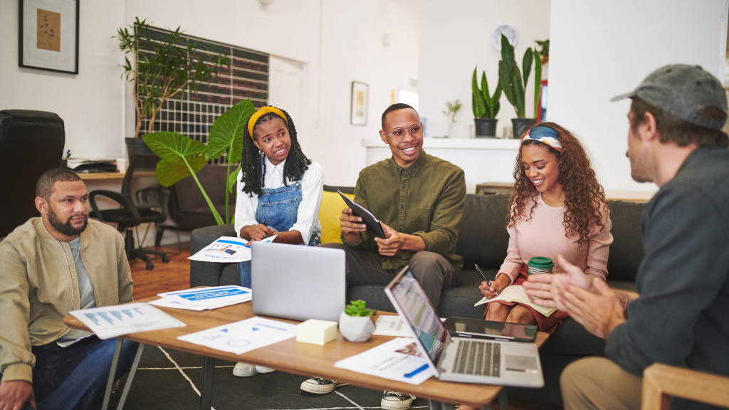 sitting in the office and brainstorming while using technology